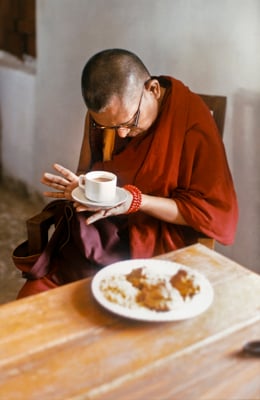 Lama Zopa Rinpoche blessing food as an offering to lepers, Bodhgaya, 1990. Photo by Andy Melnic.