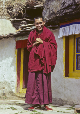 Lama Zopa Rinpoche in front of the Lawudo Lama&#039;s cave at Lawudo Retreat Centre, Nepal, 1978. Photo: Ueli Minder.