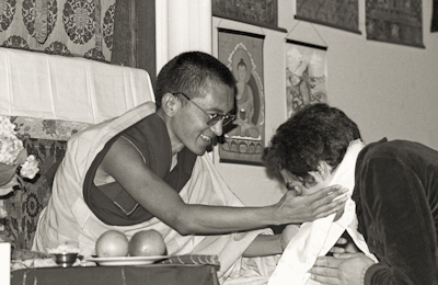 Lama Zopa Rinpoche blessing students at Manjushri Institute, England, 1976.