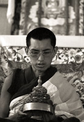 Lama Zopa Rinpoche doing mandala offering during the 9th Meditation Course, Kopan Monastery, Nepal, 1976.