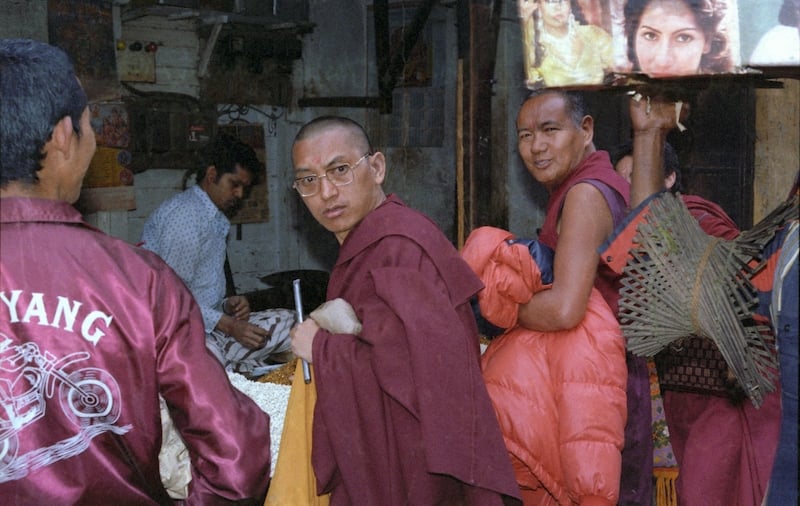 Lama Zopa Rinpoche and Lama Yeshe shopping with Ven Tenpa Choden (left) and Ven Jamyang Wangmo (hidden right), Kangra, India, 1982. A similar image is in Chapter 7, p. 324 of Big Love.