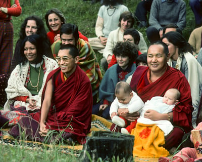 Lama Zopa Rinpoche and Lama Yeshe with babies and Italian students in Taceno, Italy, 1976. Photo: Peter Iseli.