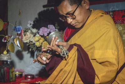 Lama Zopa Rinpoche doing puja, Bodhgaya, India, 1982. Photo: Dieter Kratzer
