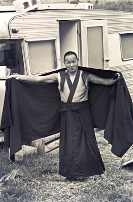 Lama Yeshe adjusts his robe during the month-long course at Chenrezig Institute, Australia, 1975.