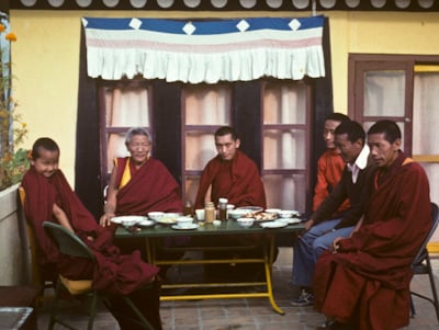Yangsi Rinpoche, Geshe Legden and Lama Zopa Rinpoche, with Lama Lhundrup at the right, on the rooftop terrace, Kopan Monastery, Nepal, 1976. 