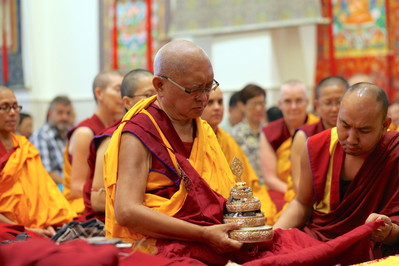 Rinpoche offers a mandala before initiation at ABC, Singapore, March 2016. Photo: Lobsang Sherab.