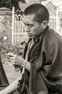 Lama Zopa Rinpoche doing puja, Manjushri Institute, England, 1979. Photo: Brian Beresford.