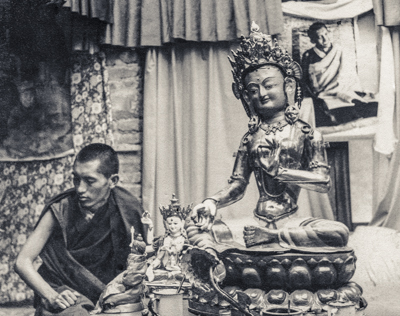 Lama Zopa Rinpoche with Tara statue prior to installation in the courtyard, Kopan Monastery, Nepal, 1976.