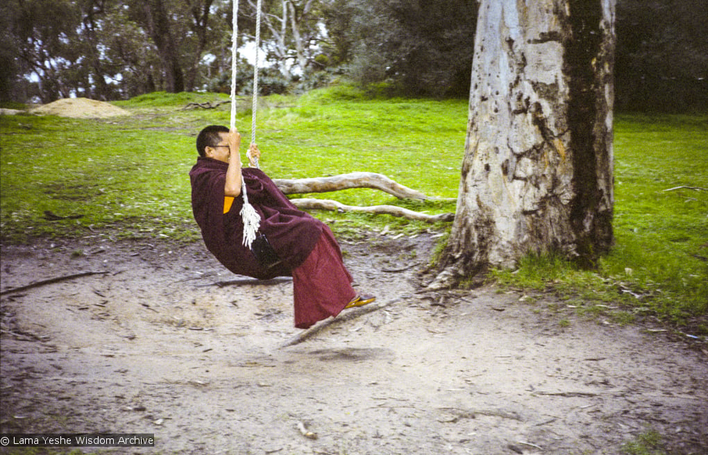 Lama Zopa Rinpoche swinging in Adelaide, Australia, 1983. Photo: Wendy Finster.